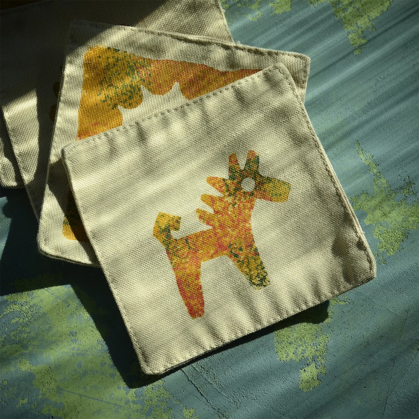 block printed cup mats with the symbol of hourse