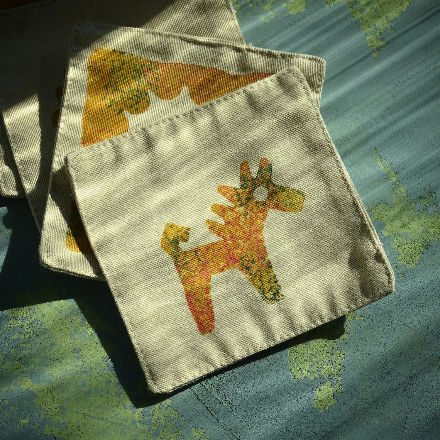 block printed cup mats with the symbol of hourse