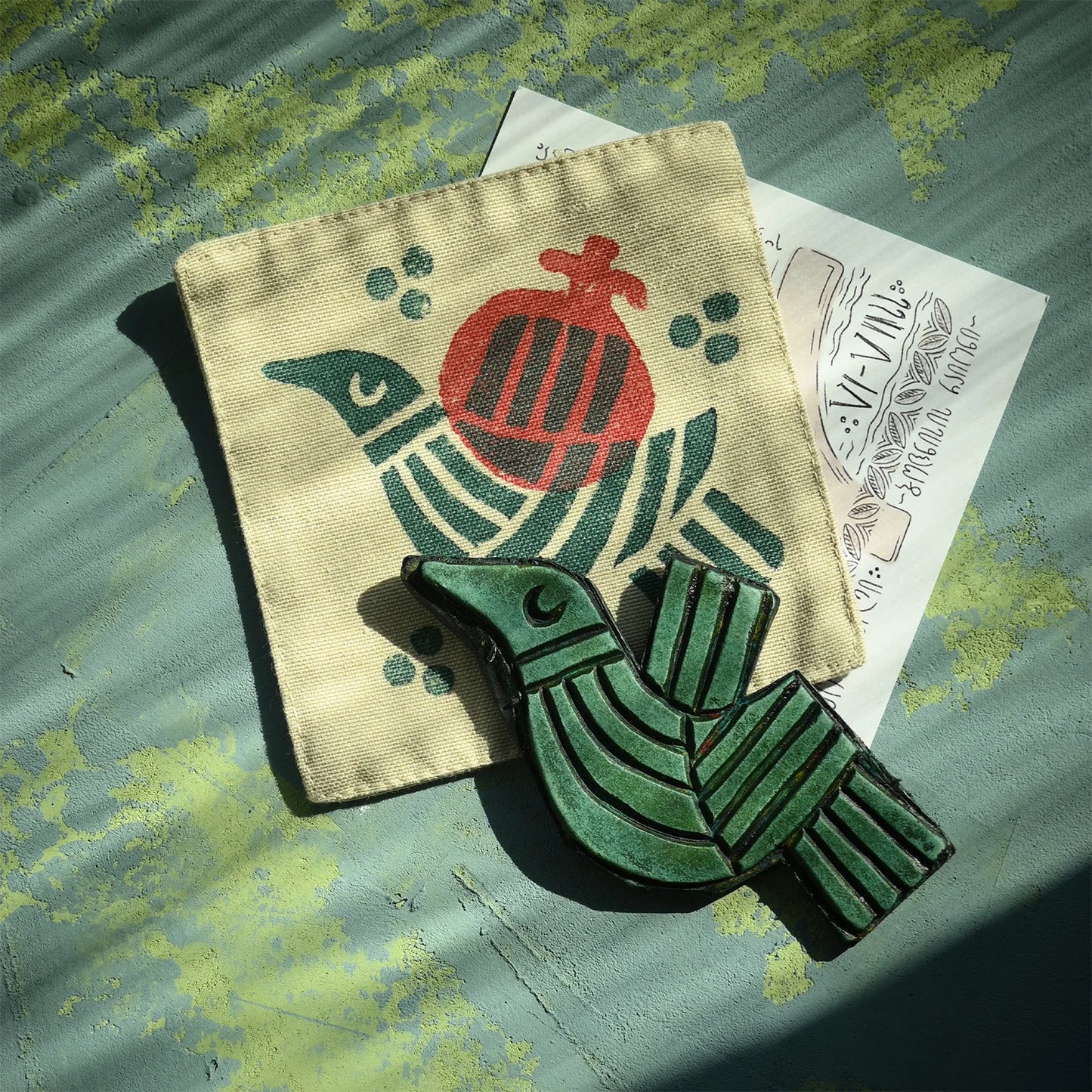 hand printed table coaster made by cotton, with bird and fruit symbols
