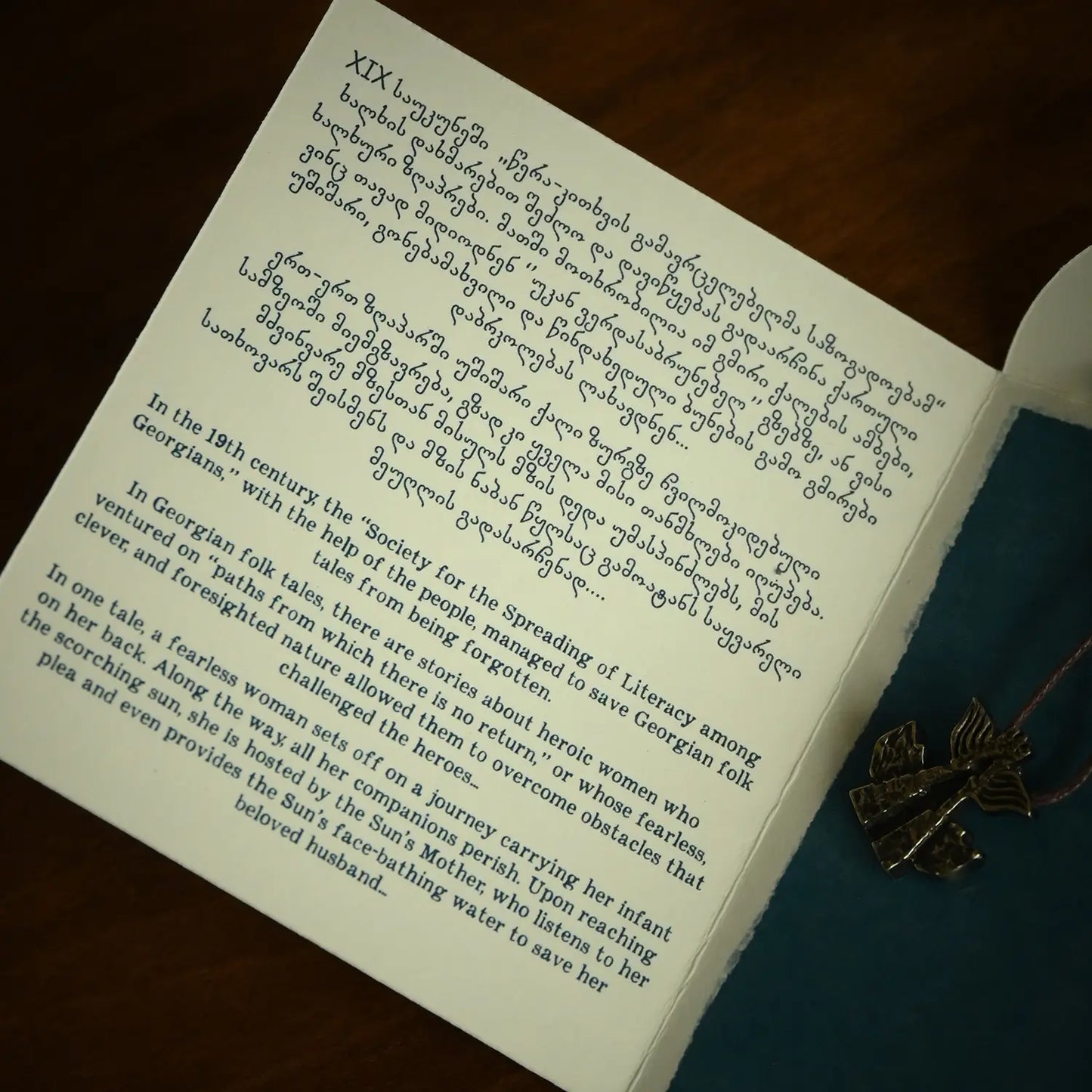 Georgian brass necklace story card showing traditional symbolism and meaning
