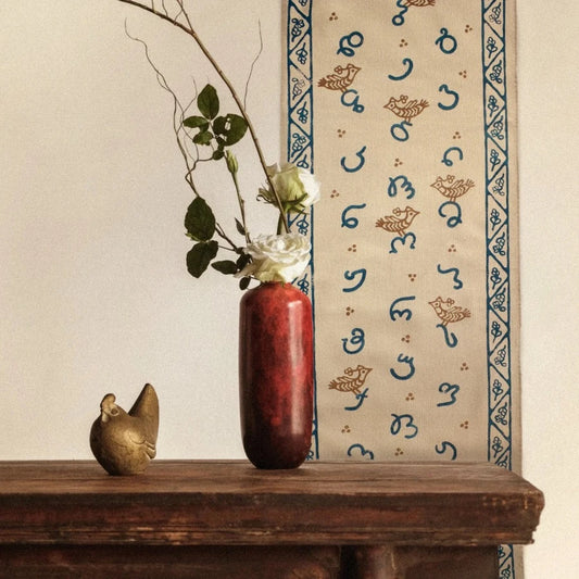 textile wall art with Georgian alphabet and cute birds