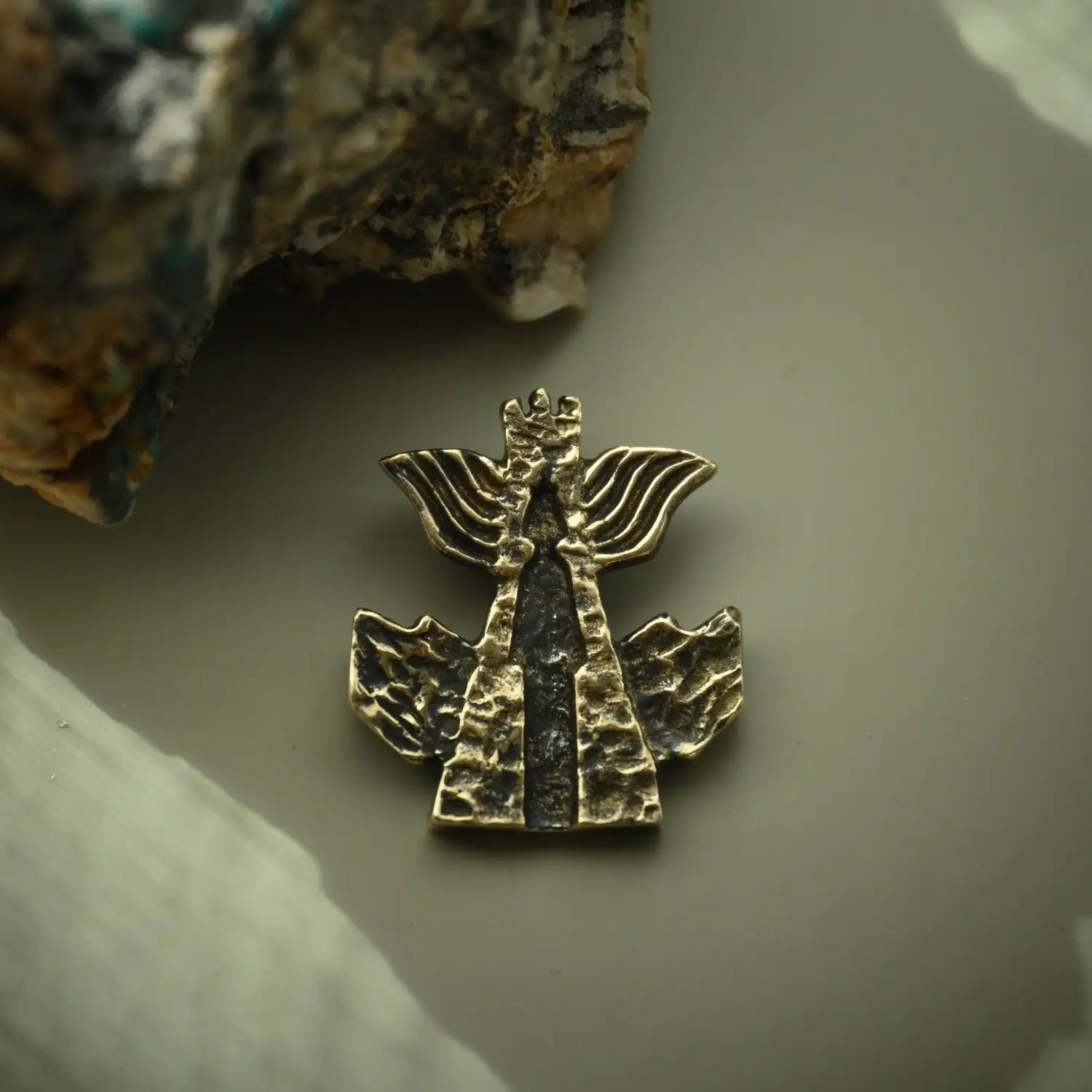 Modern brass necklace featuring traditional Georgian symbolic motif
