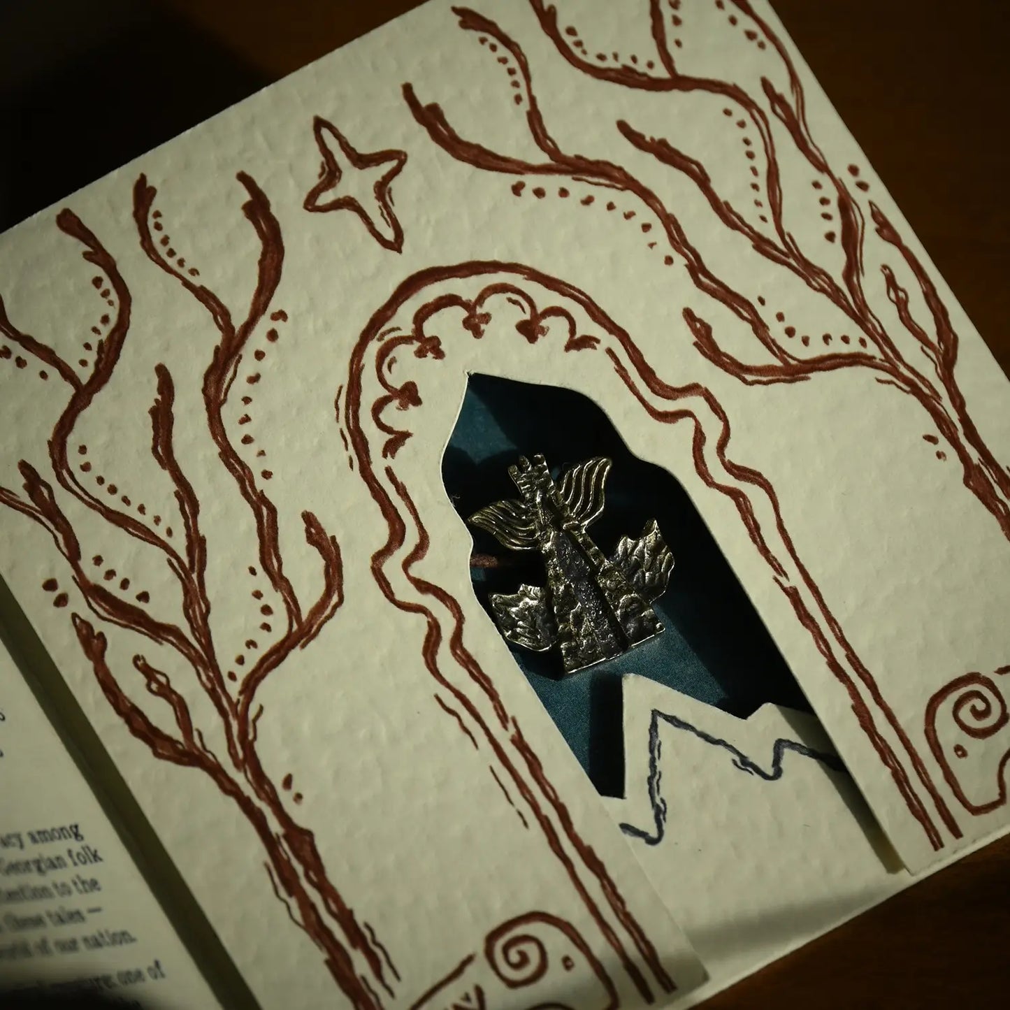 Detail of handcrafted brass necklace chain and pendant, made in Georgia
