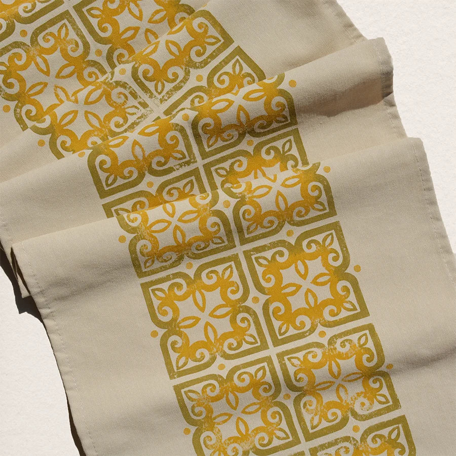 gold and yellow colored table runner
